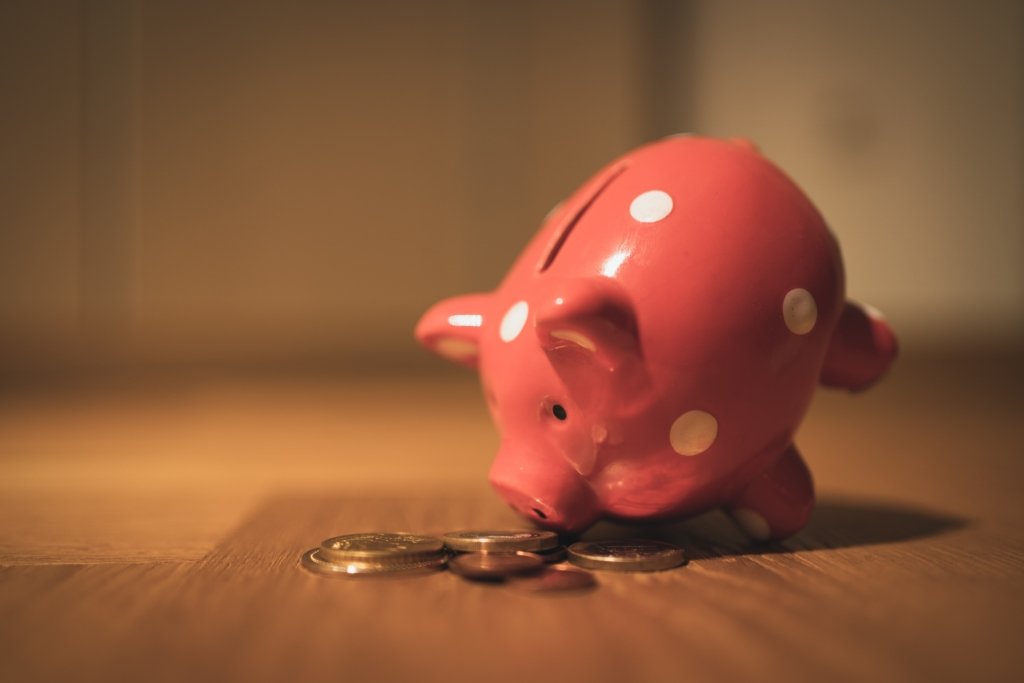 Costs of buying a house - Piggy bank with coins