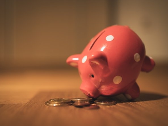 Costs of buying a house - Piggy bank with coins